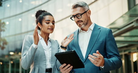 Business, employees and explain with tablet in city outdoor for email with teamwork and...