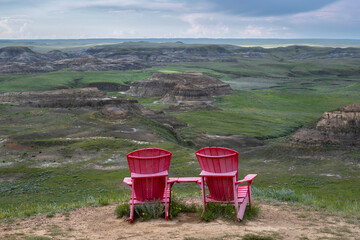 Red Chairs overlooking the Valley of 1000 Devils in Grasslands National Park, Saskatchewan, Canada