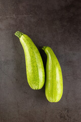Fresh young zucchini on Dark Table - Summer Harvest