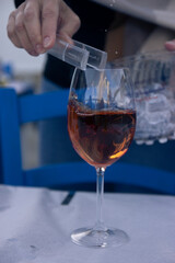 Glass of rose wine in the restaurant 