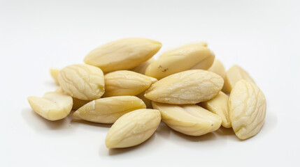 White blanched almond nuts on white background. Ideal for healthy eating, snacks, and nutrition concepts.