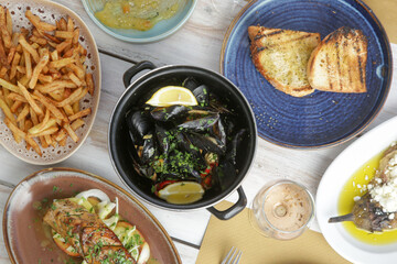 Various Mediterranean dishes served on the restaurant table	