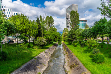 A view down the Tirane river in central Tirana, Albania in summertime