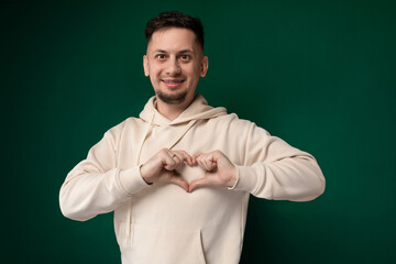 Man Making Heart Gesture With His Hands