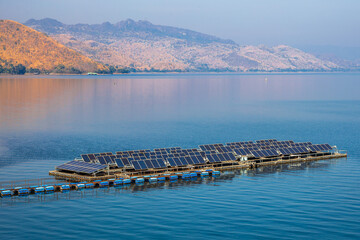 Solar cells in water floating in a large water storage dam provide a clean alternative energy...