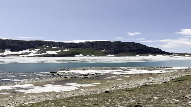 Scenics lake in the mountains during the snow melt