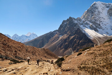 Walking down from Dughla, Thukla village into the valley of Pheriche village, Mount Kangtega, Thamserku, Tobuche in the background, Mount Everest Base Camp Trek, EBC, Nepal