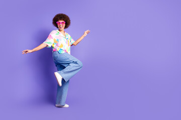 Full size photo of pretty young woman dance empty space wear shirt isolated on violet color background