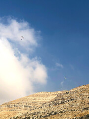 Parachute in the sky over the mountains