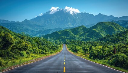 Fototapeta premium Serene Road Winding Through Lush Green Mountains