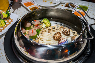 Steamed food in water bath, a new form of cooking in Vietnam. Brings little health benefits and is delicious