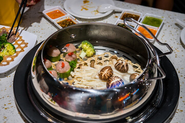Steamed food in water bath, a new form of cooking in Vietnam. Brings little health benefits and is delicious