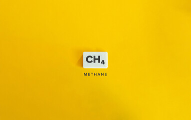 Methane (CH₄). Greenhouse Gas (GHG). Text on Block Letter Tile on Yellow Background. Minimalist Aesthetics.