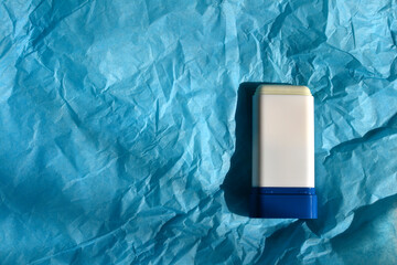 SPF stick mockup on a blue background