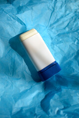 SPF stick mockup on a blue background