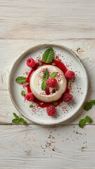 Delicious Panna Cotta Dessert with Fresh Raspberries and Mint