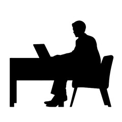 silhouette  of a man working on a laptop