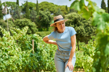 Young female farmer. Woman working during harvesting time