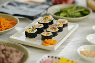 Close-up of kimbap from meat and vegetables on kitchen table