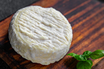 soft cheese cow milk, goat or sheep cheese natural fresh appetizer meal food snack on the table...