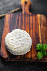 soft cheese cow milk, goat or sheep cheese natural fresh appetizer meal food snack on the table copy space food background rustic top view