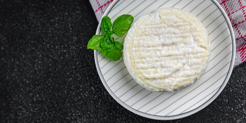 soft cheese cow milk, goat or sheep cheese natural fresh appetizer meal food snack on the table copy space food background rustic top view