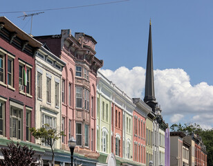 Kingston, NY - May 28, 2024: View of historic buildings with shops and restaurants on Wall street...