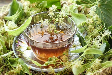 Linden flowers in a cup of tea, close-up