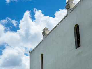Old building wall under a clear blue sky