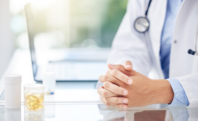 Table, hands and doctor with pills for treatment, prescription and medicine for wellness in clinic. Healthcare, medical worker or pharmacist with container of tablets, capsule and vitamin supplements