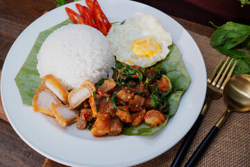 Thai food Crispy pork with basil and fried eggs