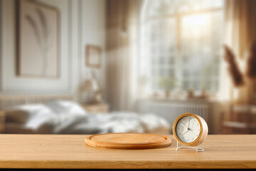 Alarm clock on wooden table top. Sunlit Morning in Bright Bedroom and Alarm Clock in Focus – Daily Routine Concept
