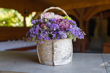 Flowers in a wooden pot.