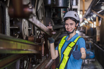 Engineer checking construction process railway and checking work on railroad station . Railway engineer checking machines in train station. Train engineer concept