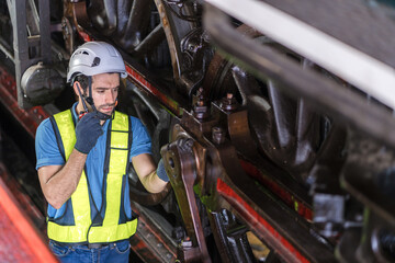 Engineer checking construction process railway and checking work on railroad station . Railway...