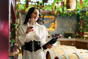 Beautiful caucasian white woman testing wine.