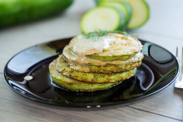 zucchini fried in batter with sauce