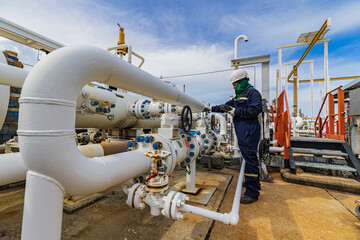 Male worker inspection and measurement thickness pipeline oil and gas at check record pipeline