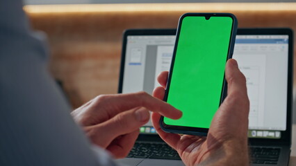 Closeup mockup cellphone scrolling man finger at workplace. Manager browsing