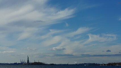 The blue sky view with the white clouds in the sunny day