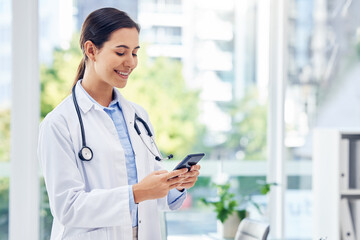 Hospital, doctor or happy woman with phone for research, reading news or medical information....