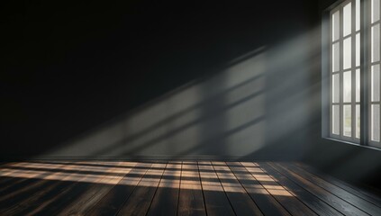 A dark room with an empty wall and a wooden floor, illuminated by sunlight streaming through a window.