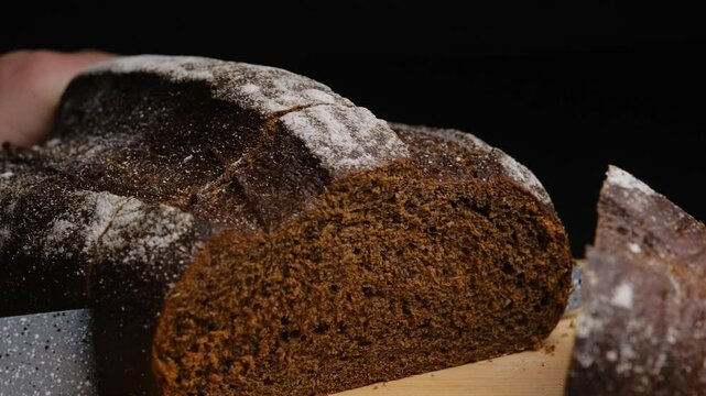fresh black bread is cut into pieces