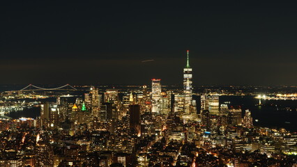 Fototapeta premium The New York city night view with the lights on in the skyscrapers at night