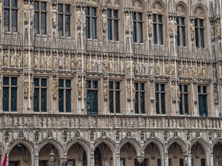 Sculptures of nobles adorn the Town Hall building on the Grand Place in Brussels