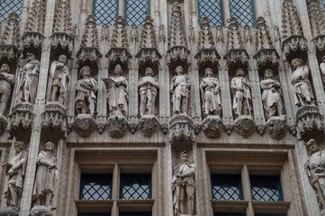 Sculptures of nobles adorn the Town Hall building on the Grand Place in Brussels