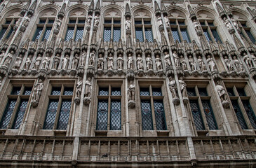 Sculptures of nobles adorn the Town Hall building on the Grand Place in Brussels