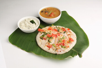 Uthappam or Uttapam is a type of dosa from southern India that is thicker, with tomato, onion, chilli packets.