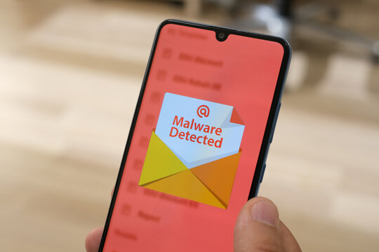 Smartphone Screen Displaying 'Malware Detected' Warning Message - Cybersecurity Alert Concept