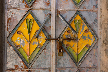 An old iron door with bright colors. This photo was taken in the Sultanate of Oman, Nizwa
